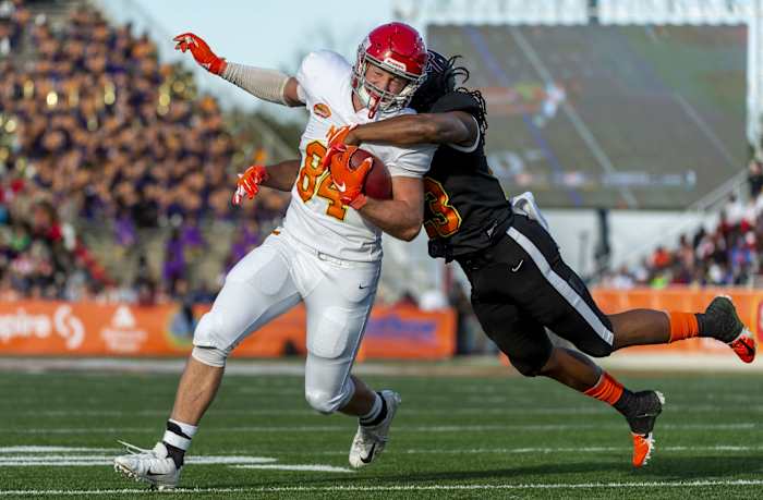 Jan 25, 2020; Mobile, AL, USA; North tight end Adam Trautman of Dayton (84) runs a reception through South safety Kyle Dugger of Lenoir Rhyne (23) during the 2020 Senior Bowl college football game at Ladd-Peebles Stadium. Mandatory Credit: Vasha Hunt-USA TODAY Sports